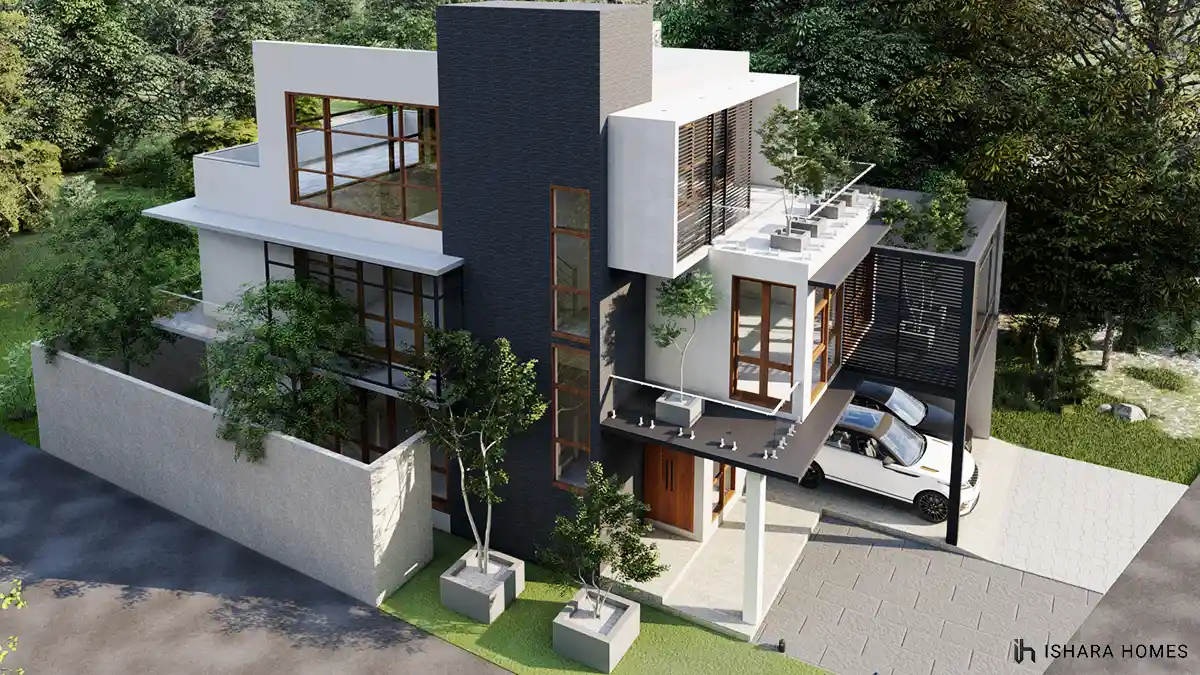 An aerial angle captures the full box-type massing of the house in Kurunegala, with its dark stone-clad tower, layered flat roofs, and a slatted...
