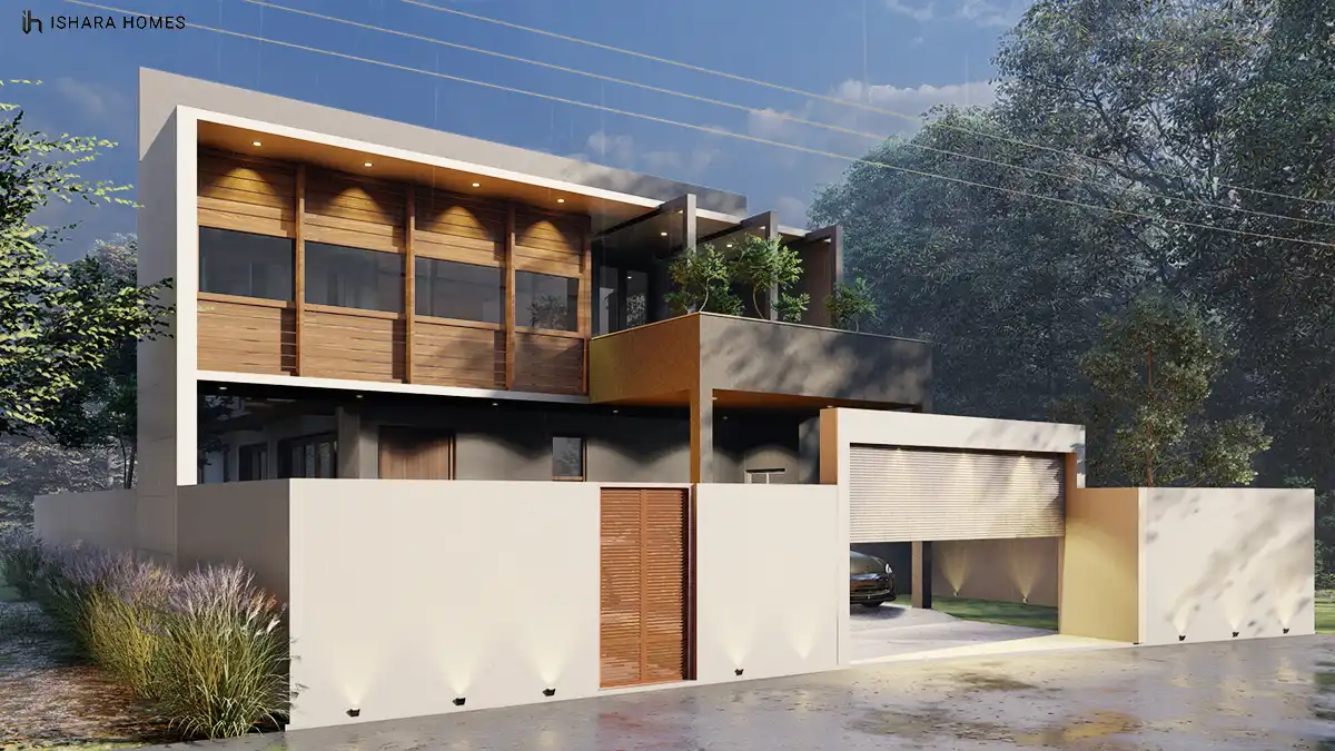 From an angled approach, the glass and timber upper storey steps back over a dark rendered base, with a wood-panelled gate and uplighting tracing...