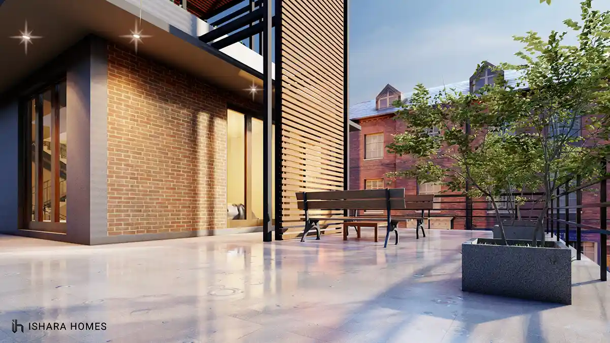 On the rooftop terrace, a pair of park-style benches sit beside a brick-clad corner room and slatted timber column, with polished stone flooring...