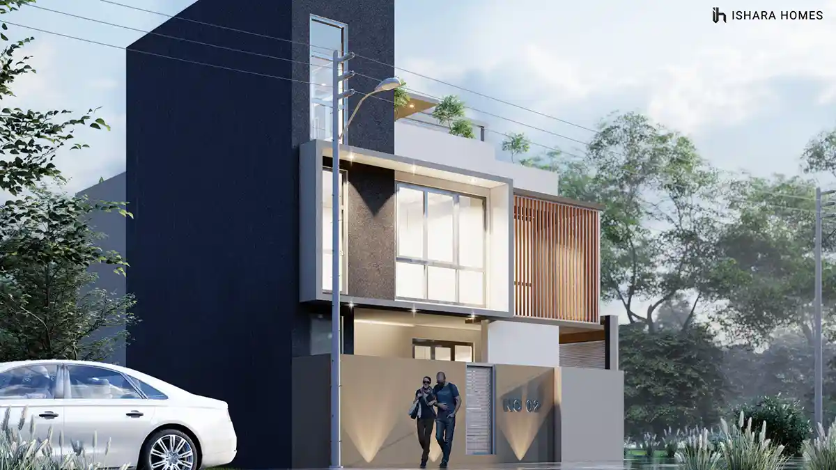 From a low angle beside the boundary wall, the home's charcoal box volume and timber screen rise above the entrance sign, softly lit as two...