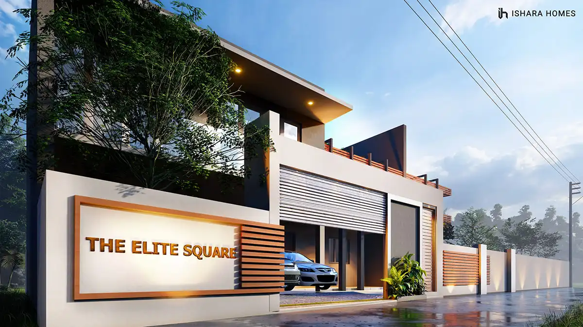 At night, the entrance glows beneath a sweeping roof overhang, its timber battens and backlit signage framing a car parked just inside the gated...