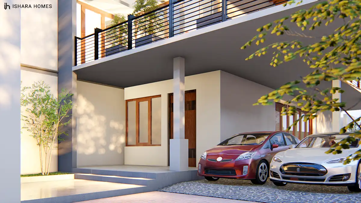 Beneath the deep overhanging balcony, a compact entry porch with timber-framed glazing shelters a private front door, while two cars are parked in...