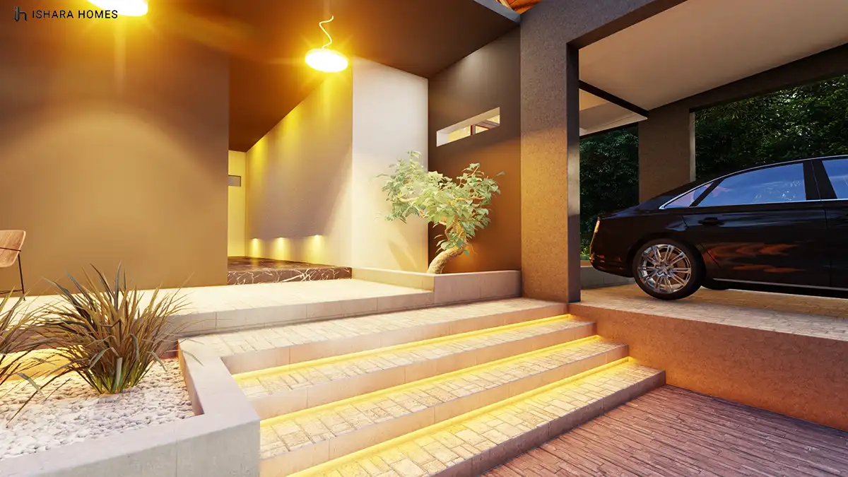 Illuminated stone steps lead up to the entrance foyer, its dark marble-effect flooring and accent lighting guiding the eye toward the covered...