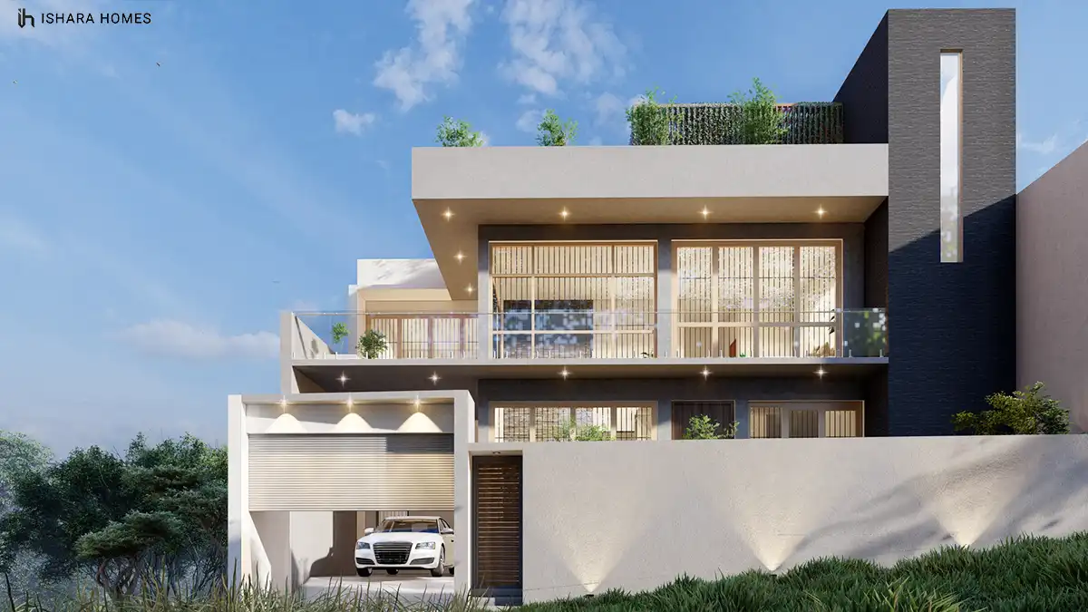 Warm interior lighting spills through slender timber-framed windows on the upper floor, where a glass balustrade overlooks the garage entrance and...