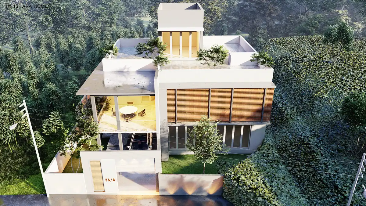 A bird's-eye look at the rear of the home, showing how the covered terrace opens onto a partially shaded dining nook and the greenery-wrapped...