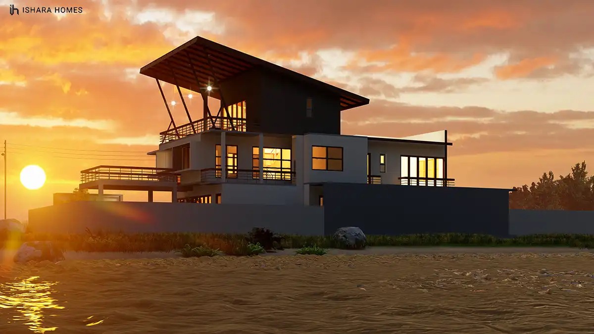 Set against a fiery sunset by the water's edge, The Royal Lake House's dramatic angled roof and warm interior lighting create a striking...