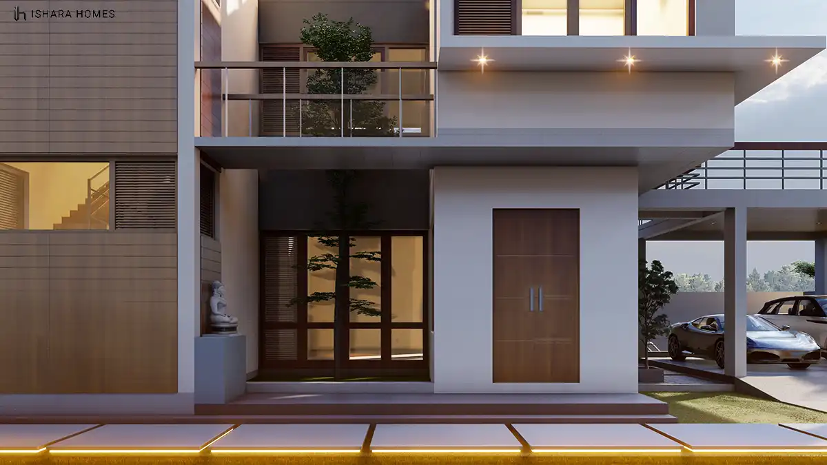 At the front door, a stone Buddha figure sits beside timber-framed glass panels and a solid wood entrance door, with a sports car and SUV visible...