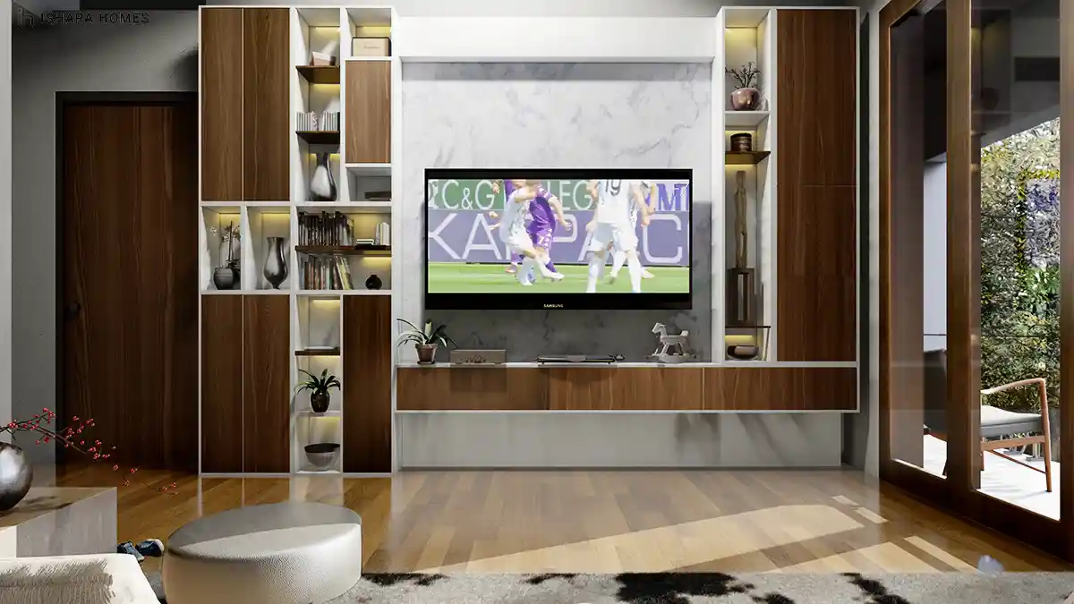 A built-in media wall of walnut and white cabinetry frames the television and display shelving, with polished hardwood flooring and a cream rug...