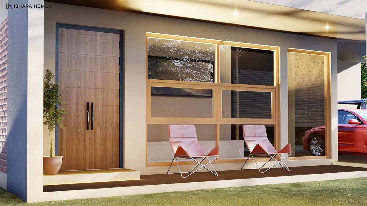 The three-quarter street view of The Springfields in daylight, its angled roof and timber-slat privacy screen rising above the No.