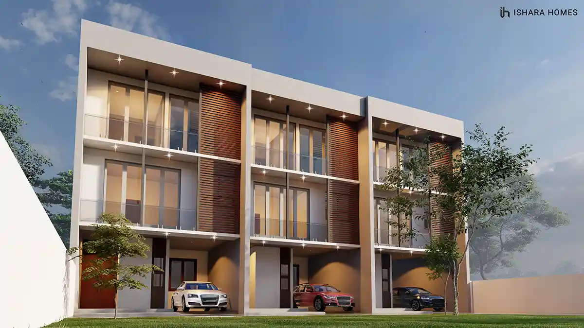 Threesis Residencies in Kurunegala, a row of three attached three-storey townhomes with matching timber-slat balconies, each unit fronted by its...